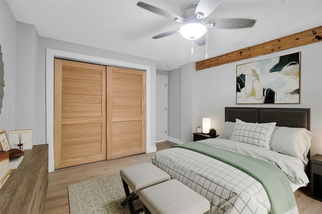 7 Georgia Ave, Crystal Beach, FL 34681 - bedroom with a closet, baseboards, ceiling fan, and wood finished floors