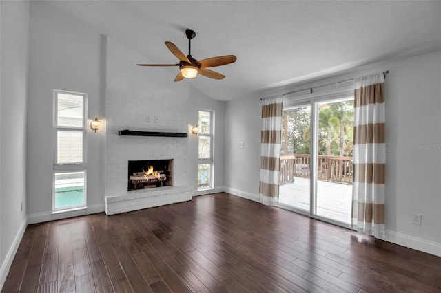 7 Georgia Ave, Crystal Beach, FL 34681 - unfurnished living room featuring a fireplace, lofted ceiling, wood finished floors, and a ceiling fan