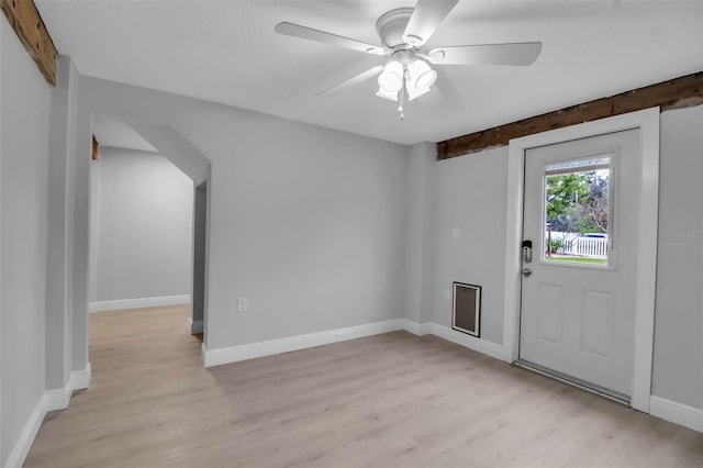 7 Georgia Ave, Crystal Beach, FL 34681 - foyer with light wood-style flooring, baseboards, and a ceiling fan