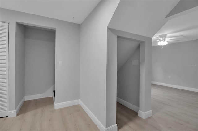 7 Georgia Ave, Crystal Beach, FL 34681 - interior space featuring vaulted ceiling, light wood-style floors, and baseboards