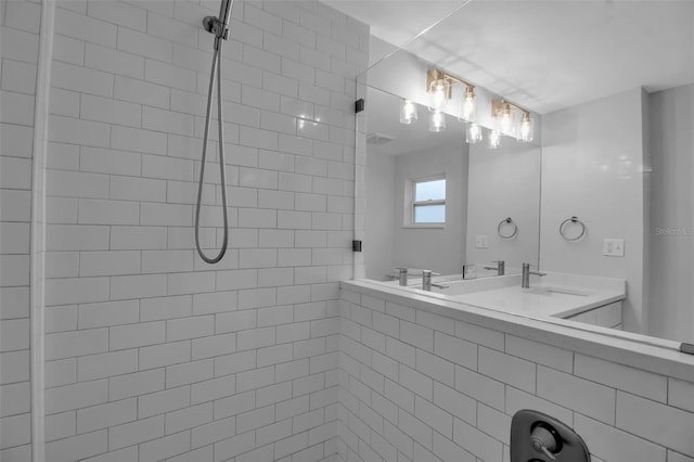 7 Georgia Ave, Crystal Beach, FL 34681 - bathroom featuring double vanity, tiled shower, and a sink