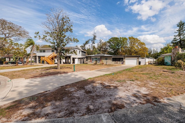 view of front facade with an attached garage and concrete driveway