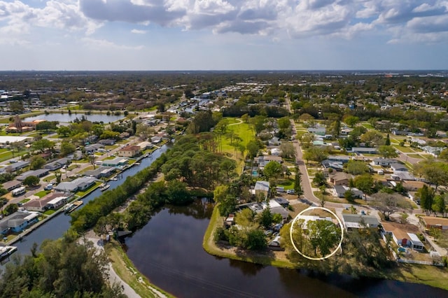 bird's eye view featuring a residential view and a water view