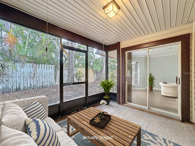 sunroom featuring wood ceiling