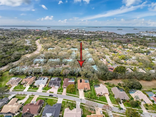 birds eye view of property featuring a water view and a residential view