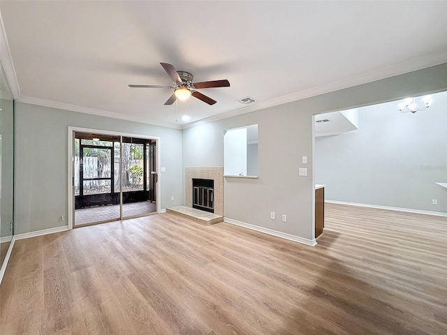 unfurnished living room featuring light wood finished floors, baseboards, a fireplace, and visible vents