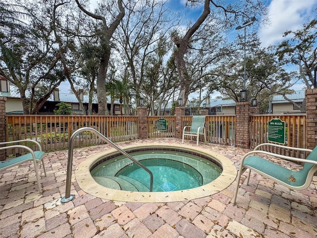 view of pool featuring a hot tub