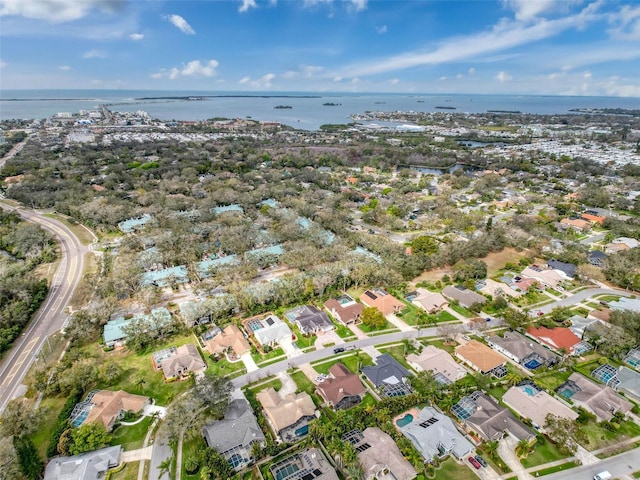 drone / aerial view featuring a water view and a residential view