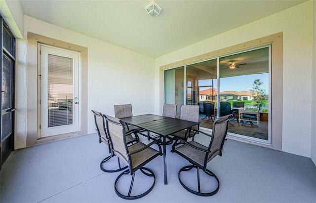 view of patio with outdoor dining area and visible vents