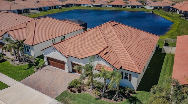 aerial view with a water view and a residential view