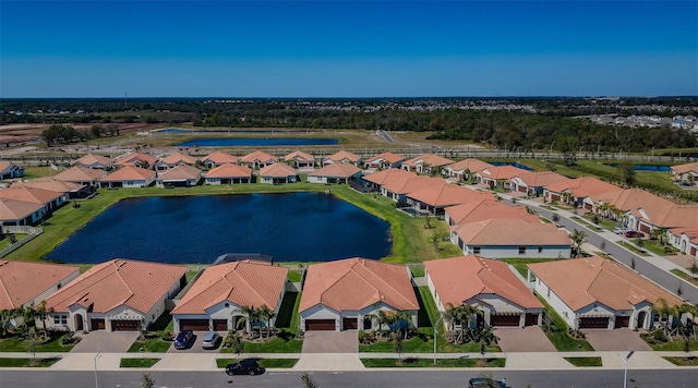 birds eye view of property featuring a residential view and a water view