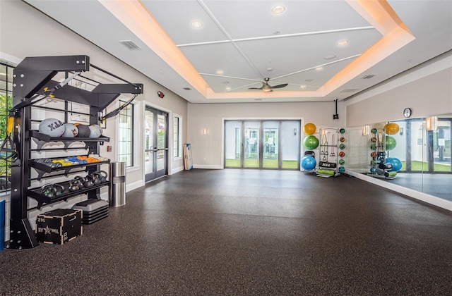 exercise room with french doors, recessed lighting, a raised ceiling, visible vents, and baseboards