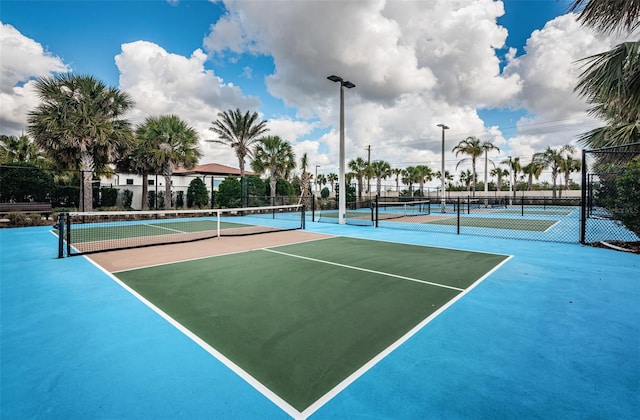 view of sport court featuring fence