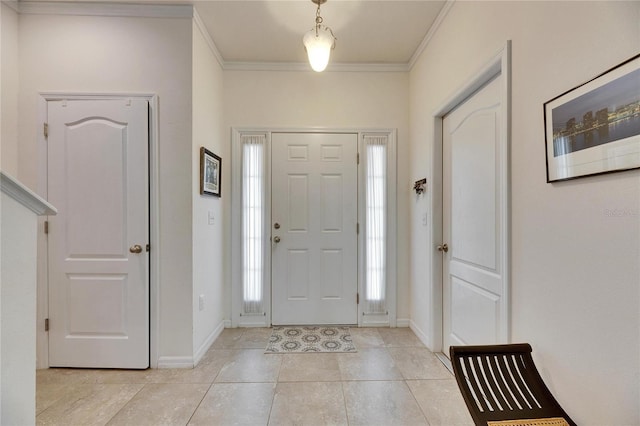 entrance foyer with light tile patterned floors, crown molding, and baseboards