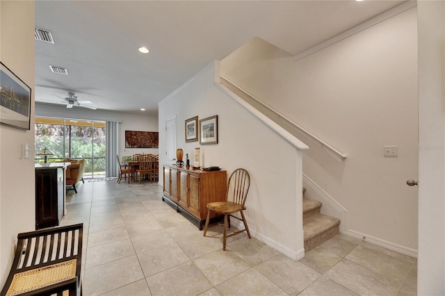 interior space with crown molding, recessed lighting, baseboards, and visible vents