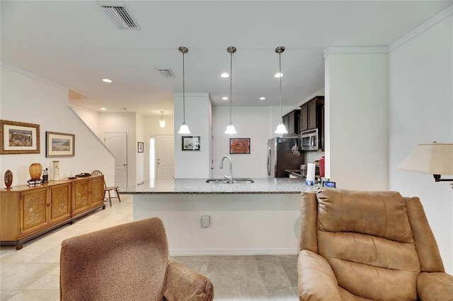 kitchen featuring a sink, stainless steel appliances, light stone counters, and visible vents