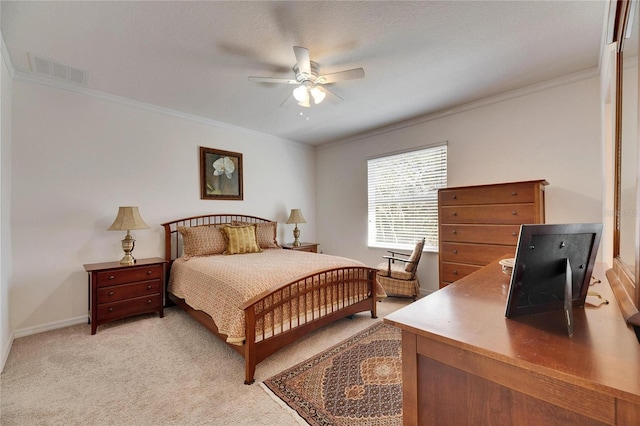 bedroom featuring a ceiling fan, baseboards, visible vents, ornamental molding, and light carpet