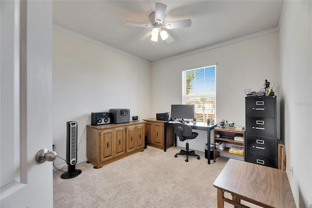 office featuring a ceiling fan, baseboards, light colored carpet, and crown molding