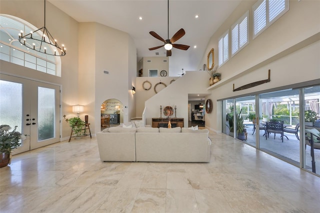 living room with recessed lighting, visible vents, ceiling fan with notable chandelier, and french doors