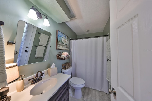 bathroom with visible vents, a shower with shower curtain, toilet, a textured ceiling, and vanity