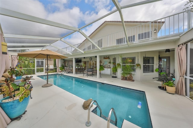 pool with a patio and a lanai