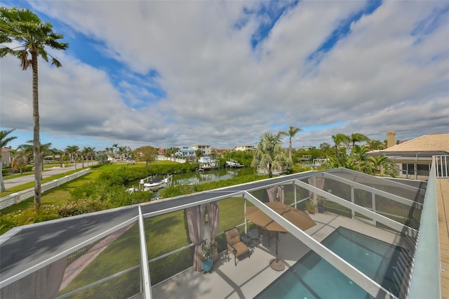 balcony featuring a water view