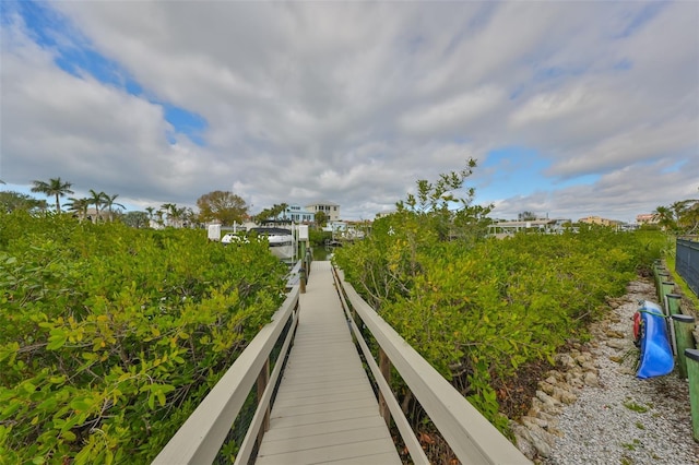 view of home's community featuring a boat dock