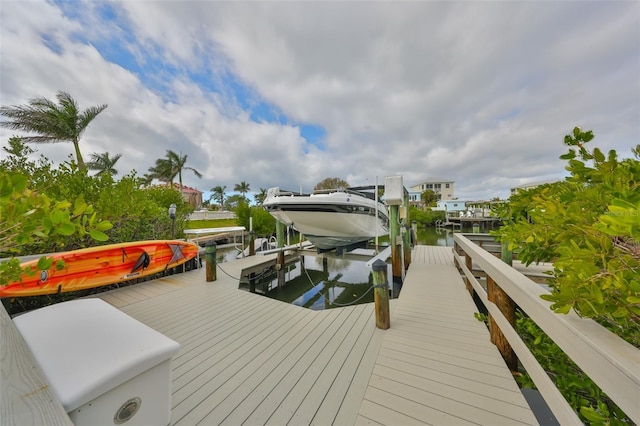 view of dock with a water view and boat lift