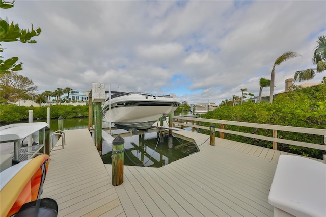 dock area featuring a water view and boat lift