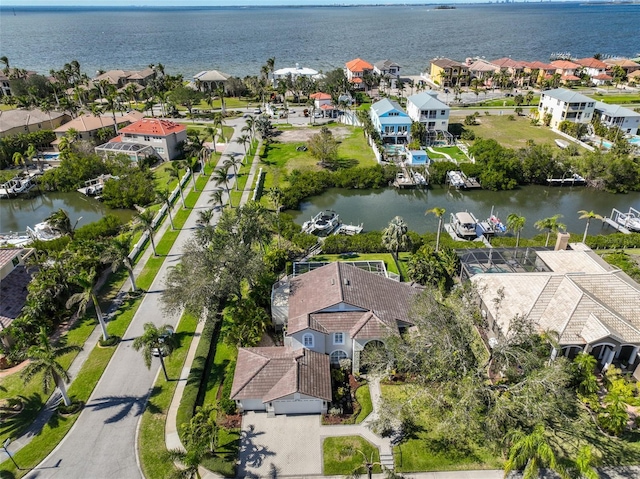 bird's eye view featuring a water view and a residential view