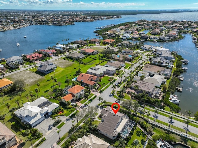 bird's eye view with a residential view and a water view