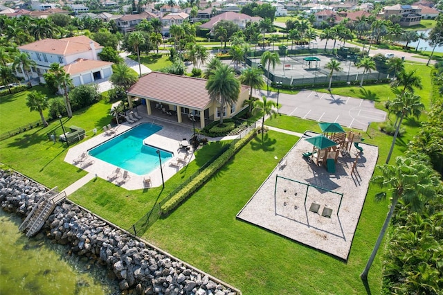 drone / aerial view with a water view and a residential view