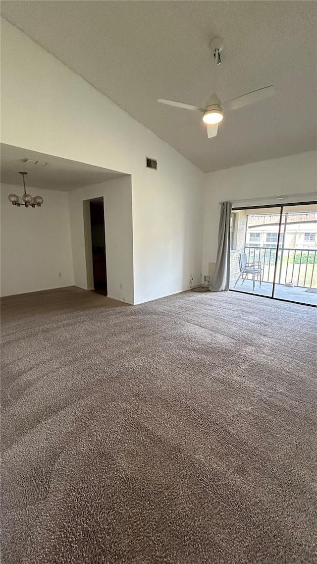 4983 Puritan Cir Unit 524, Tampa, FL 33617 - carpeted empty room with lofted ceiling, visible vents, and ceiling fan with notable chandelier