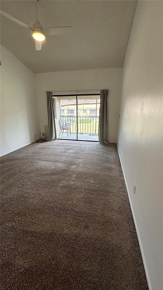 4983 Puritan Cir Unit 524, Tampa, FL 33617 - empty room with ceiling fan, carpet, and a textured ceiling
