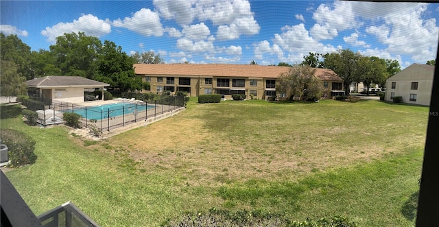 4983 Puritan Cir Unit 524, Tampa, FL 33617 - view of yard featuring a community pool