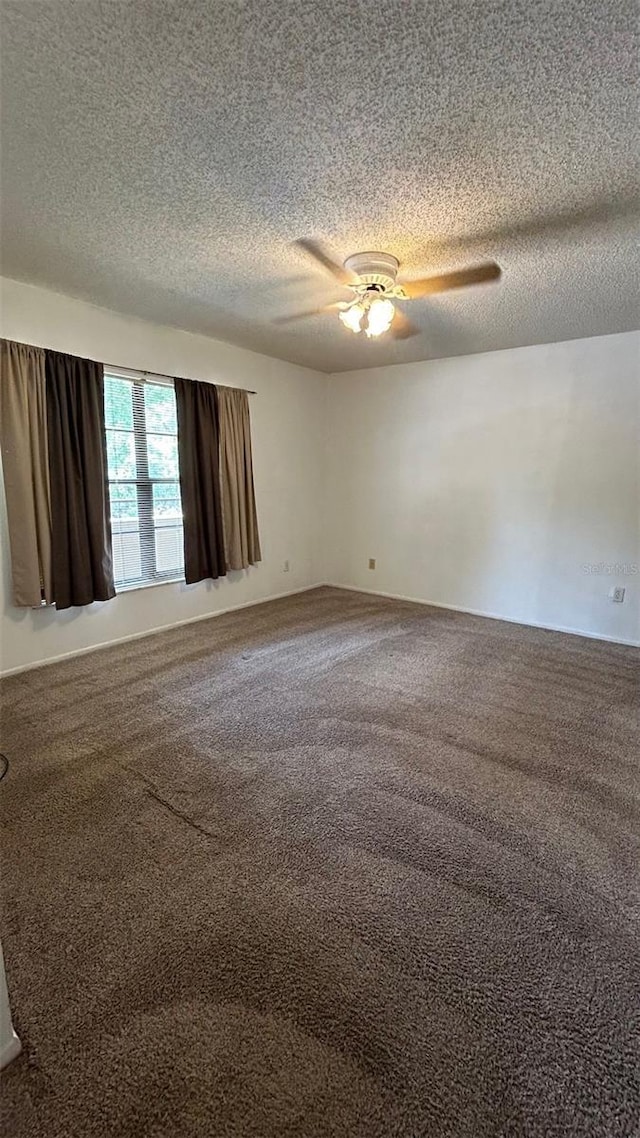 4983 Puritan Cir Unit 524, Tampa, FL 33617 - carpeted empty room with a textured ceiling and ceiling fan