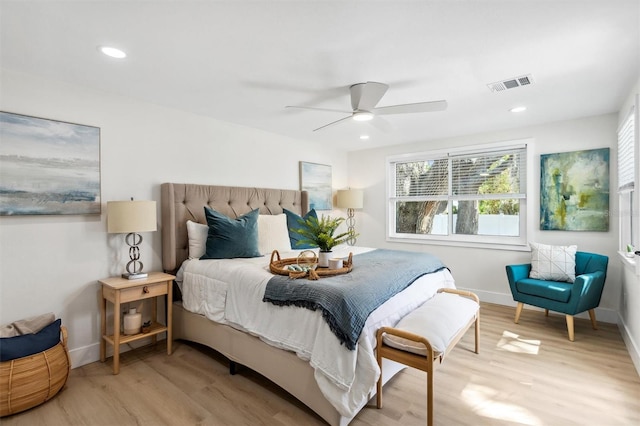 bedroom featuring wood finished floors, visible vents, and recessed lighting