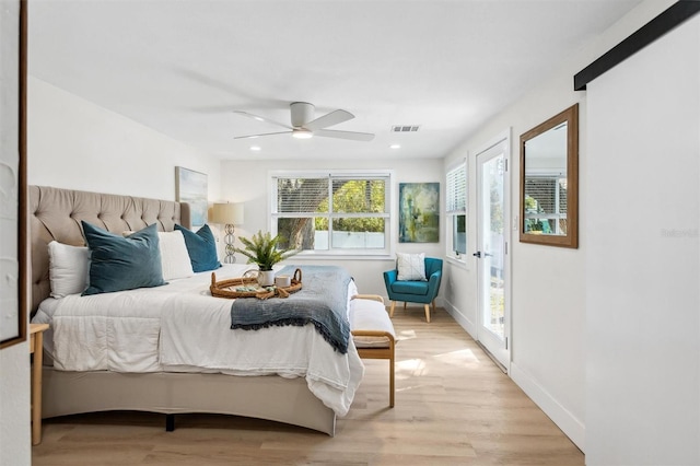 bedroom with recessed lighting, visible vents, light wood-style floors, a ceiling fan, and baseboards