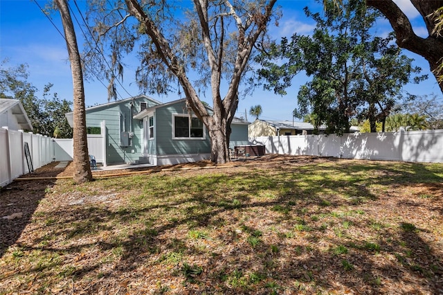 view of yard with a fenced backyard