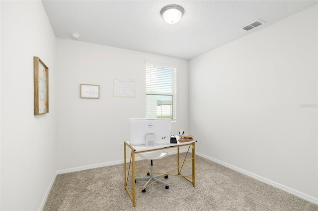 office space with carpet floors, visible vents, and baseboards