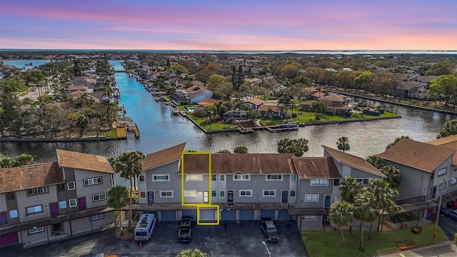 drone / aerial view with a water view and a residential view