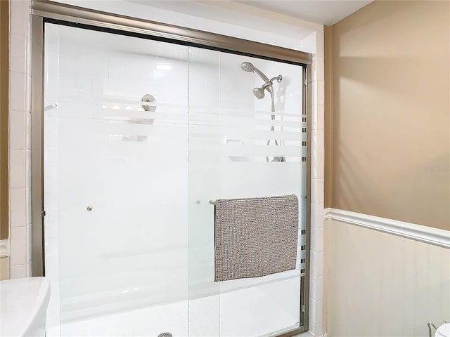 full bathroom with a shower stall