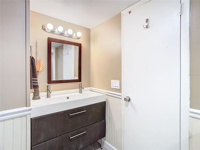 bathroom with double vanity and a sink