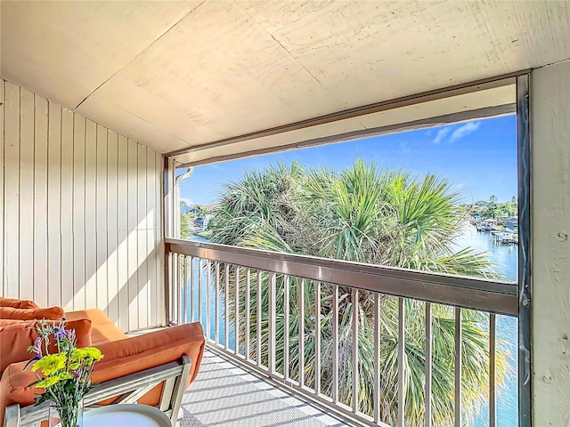 balcony featuring a water view