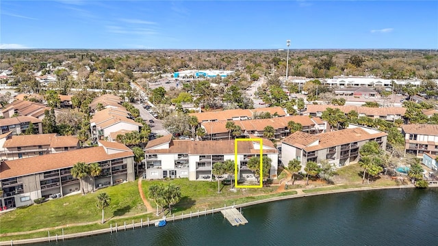 birds eye view of property with a residential view and a water view