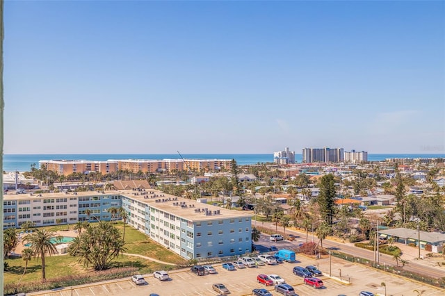 drone / aerial view featuring a view of city and a water view