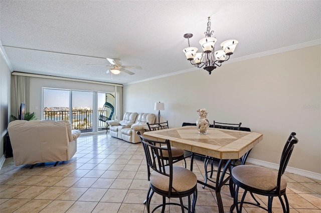 dining space with light tile patterned floors, ornamental molding, a textured ceiling, and ceiling fan with notable chandelier