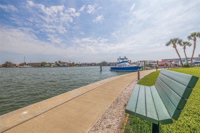 view of home's community with a dock and a water view