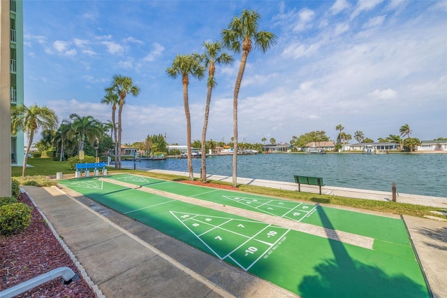 surrounding community featuring a water view and shuffleboard