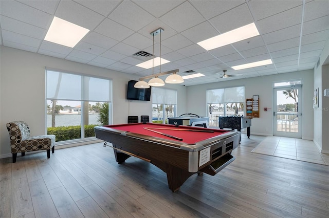 game room with visible vents, plenty of natural light, and wood finished floors